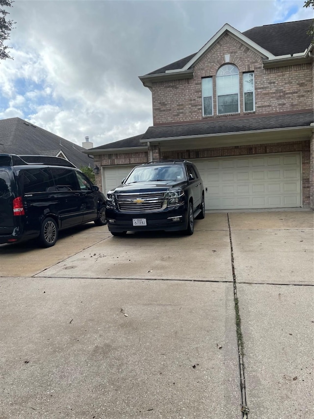 view of front of property with a garage