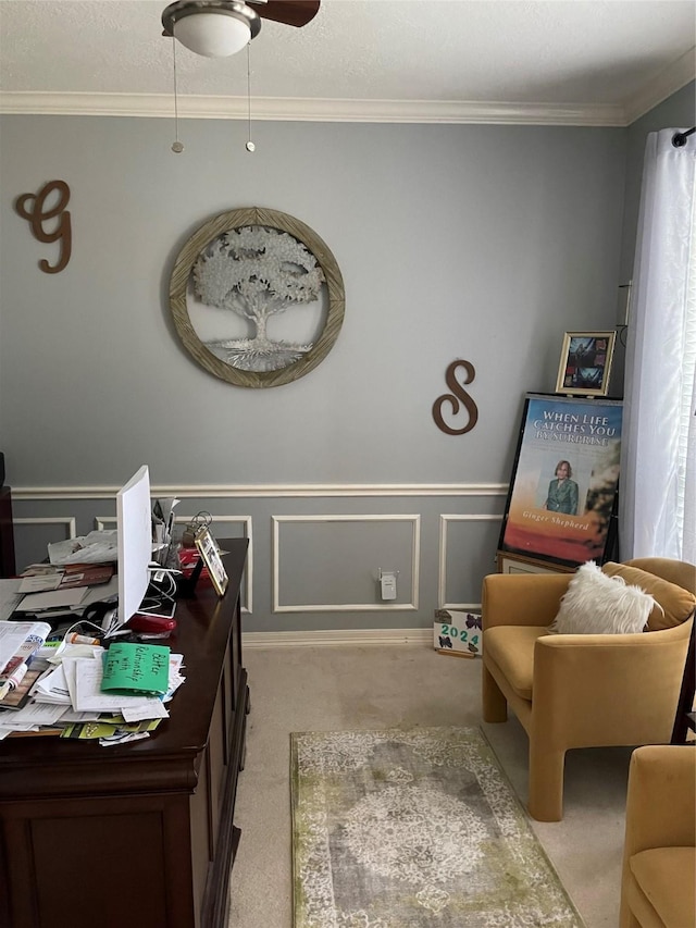 interior space featuring ceiling fan, light colored carpet, and crown molding