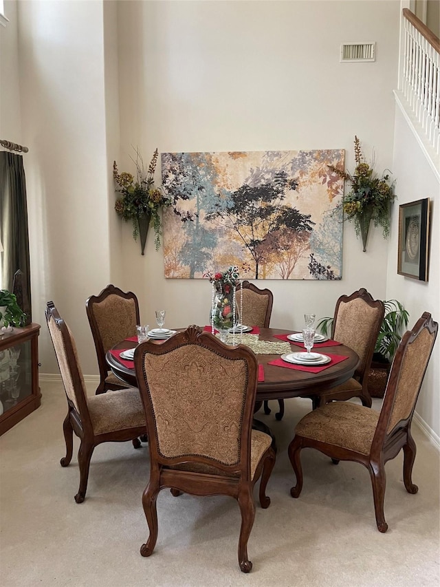 dining space featuring carpet floors