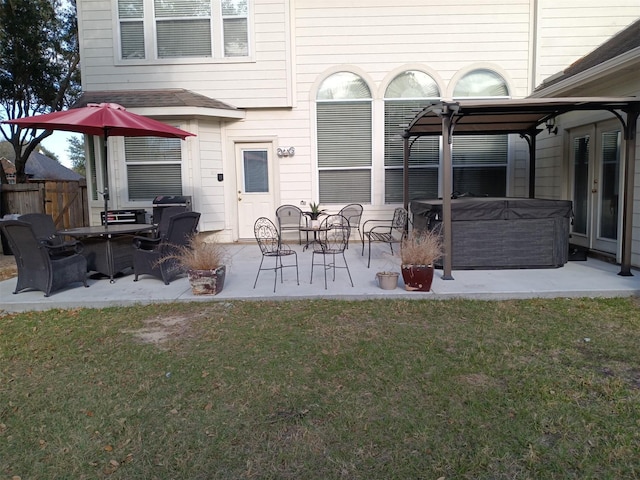 exterior space with a hot tub