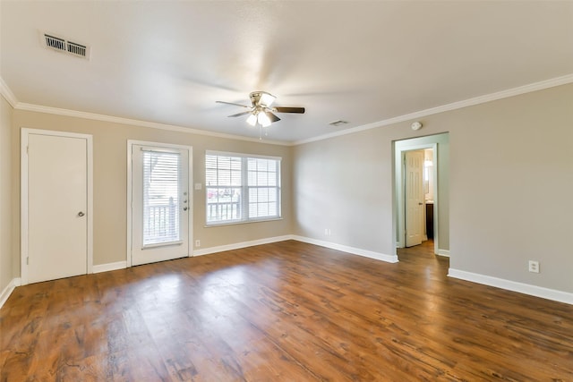 spare room featuring ceiling fan, crown molding, and dark wood-type flooring