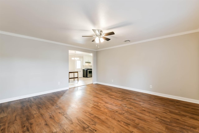 unfurnished living room with a fireplace, crown molding, dark hardwood / wood-style flooring, and ceiling fan with notable chandelier