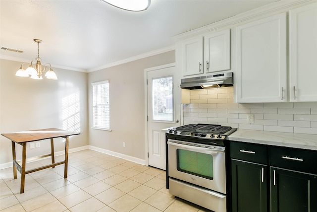 kitchen with white cabinets, tasteful backsplash, light tile patterned floors, and gas range