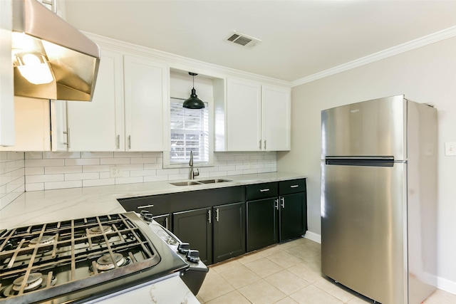 kitchen featuring stainless steel refrigerator, sink, range hood, backsplash, and white cabinets