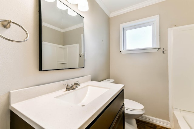 bathroom featuring toilet, vanity, wood-type flooring, and ornamental molding