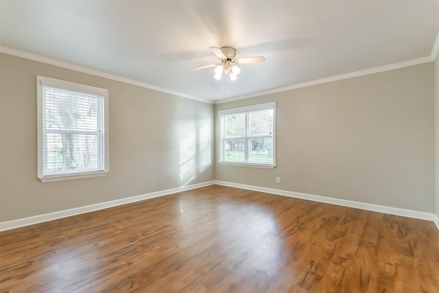 unfurnished room featuring ceiling fan, wood-type flooring, and ornamental molding