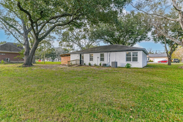 single story home featuring a front lawn and cooling unit