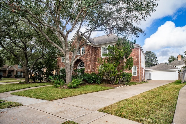 view of front of property with a garage and a front lawn