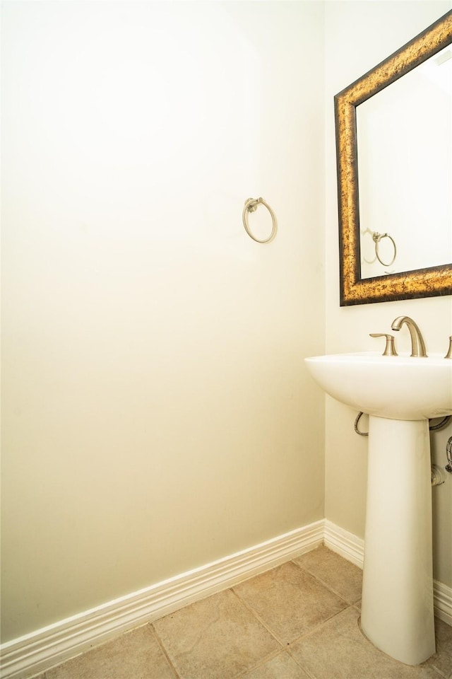 bathroom with tile patterned flooring and sink