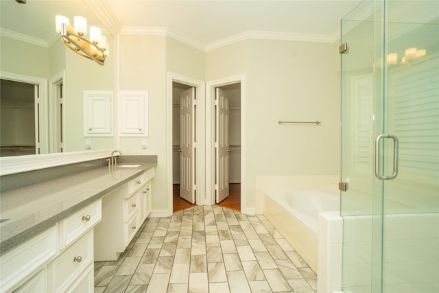 bathroom featuring vanity, independent shower and bath, and ornamental molding