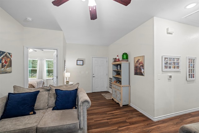 living room featuring ceiling fan and dark wood-type flooring