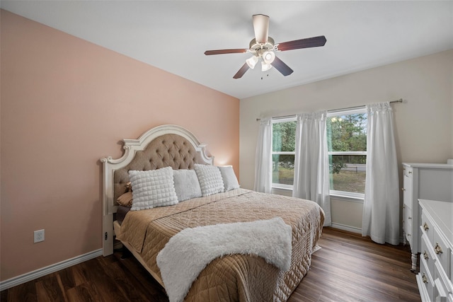 bedroom with ceiling fan and dark hardwood / wood-style floors