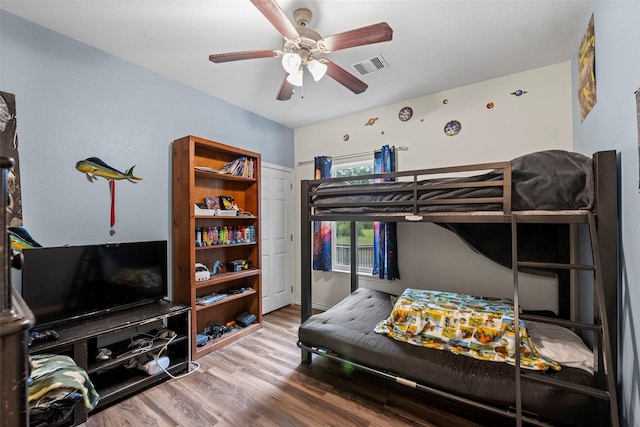 bedroom featuring ceiling fan and wood-type flooring