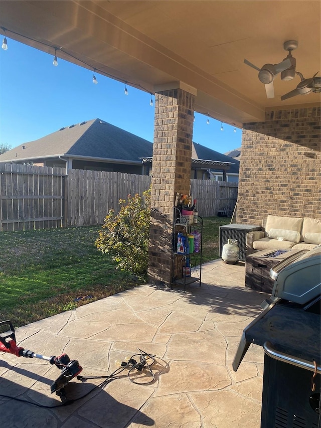 view of patio / terrace with ceiling fan and central AC