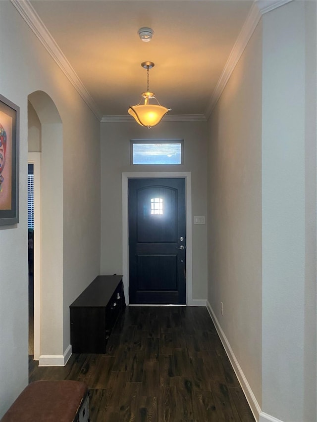 doorway to outside featuring dark hardwood / wood-style floors and crown molding