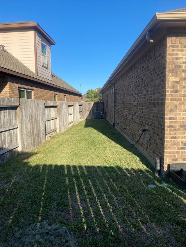 view of yard with central AC unit