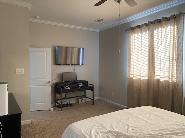 bedroom featuring carpet flooring, ceiling fan, and crown molding