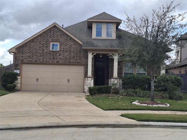 view of front of property featuring a garage and a front yard