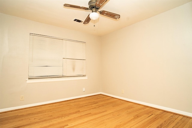 empty room with light wood-type flooring and ceiling fan