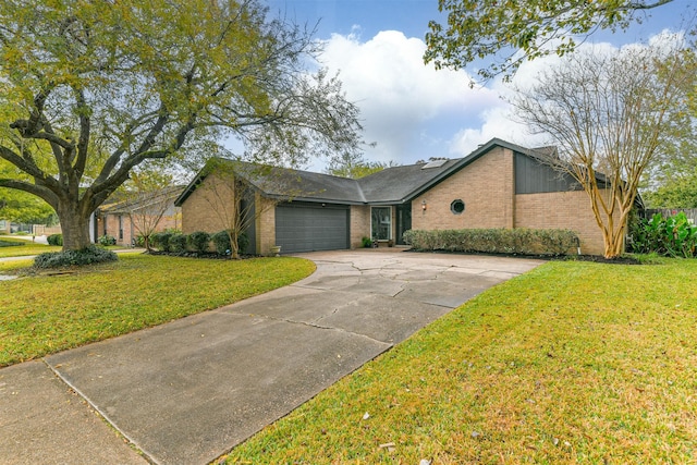 single story home with a front yard and a garage