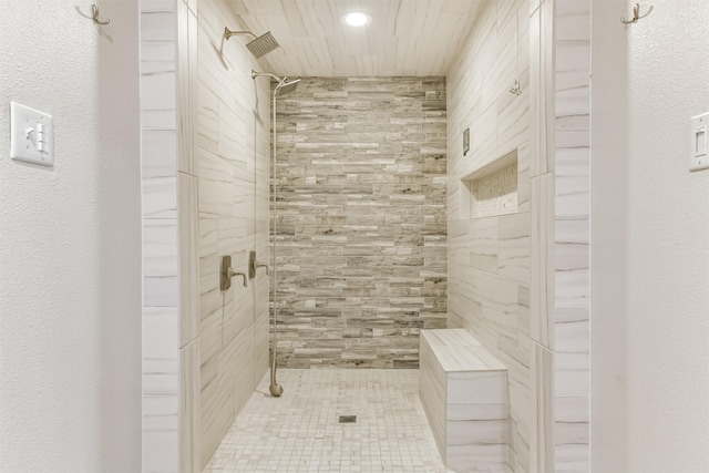 bathroom featuring tiled shower