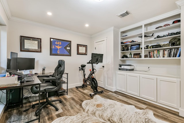 office area with wood-type flooring and crown molding