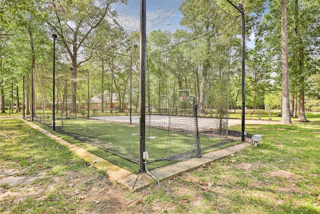 view of community with a yard and basketball court