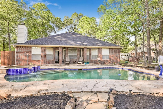 view of swimming pool with an in ground hot tub and a patio