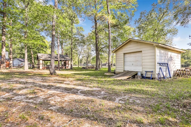 view of yard featuring a garage