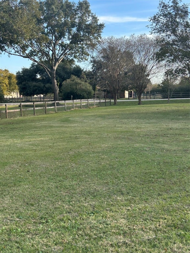 view of yard with a rural view