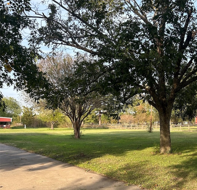 view of property's community featuring a yard