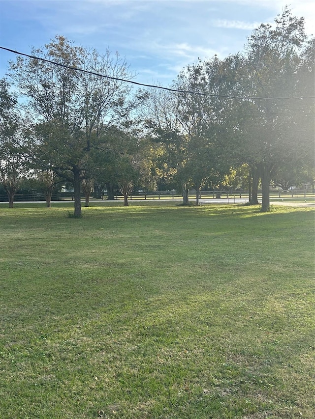 view of home's community with a yard