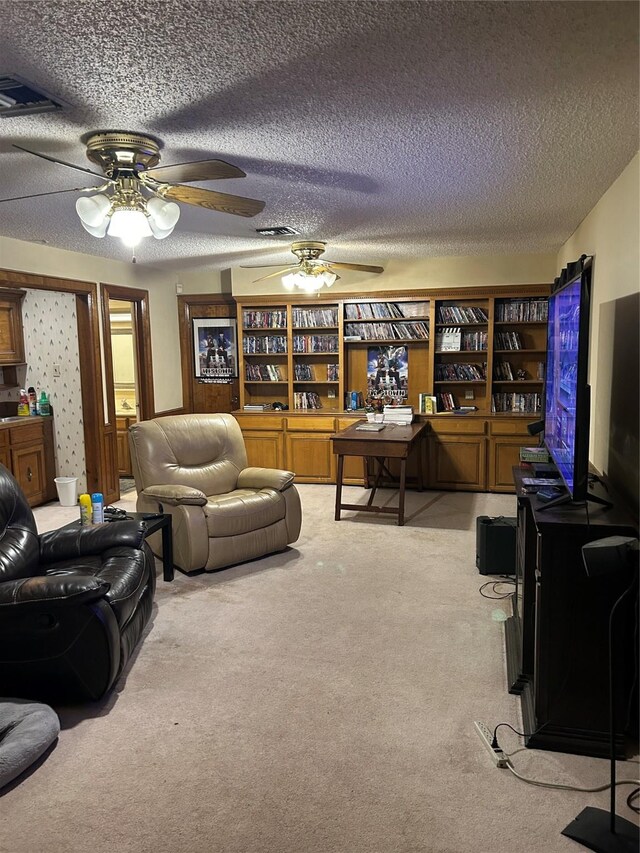 living room featuring light carpet and a textured ceiling