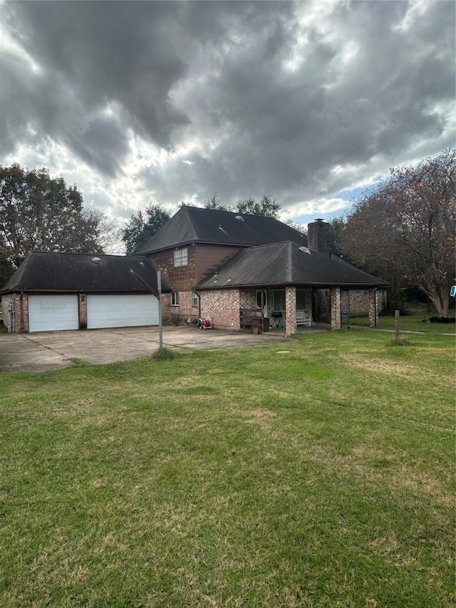 view of front of house with a front yard and a garage