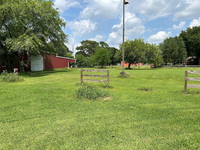 17622 Queenslake Dr, Cypress, TX 77429 - view of yard with fence, a pole building, an outbuilding, and a garage