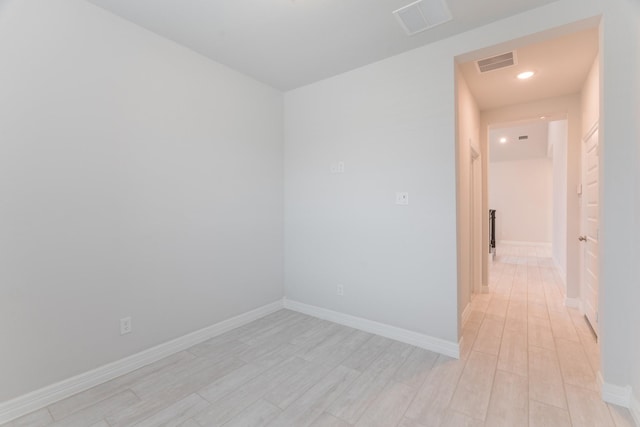 empty room with light hardwood / wood-style floors