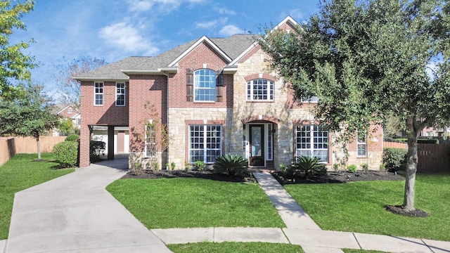 view of front of home with a garage and a front lawn