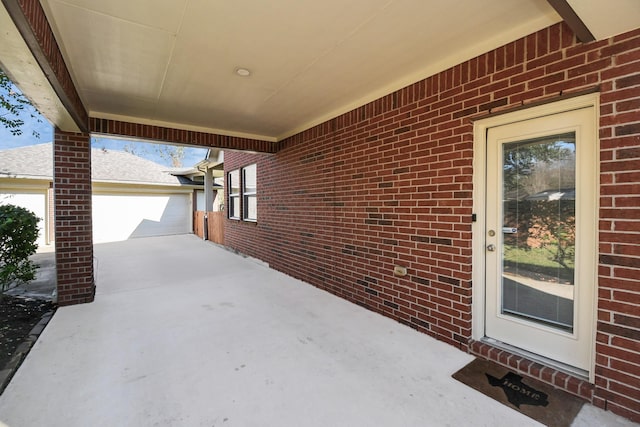 view of patio / terrace featuring a garage