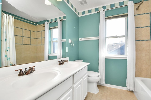 full bathroom with tile patterned flooring, shower / bath combo, toilet, and plenty of natural light