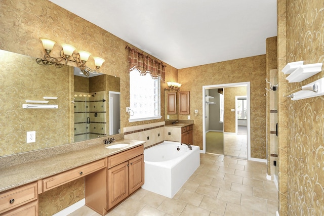 bathroom featuring tile patterned floors, vanity, and separate shower and tub