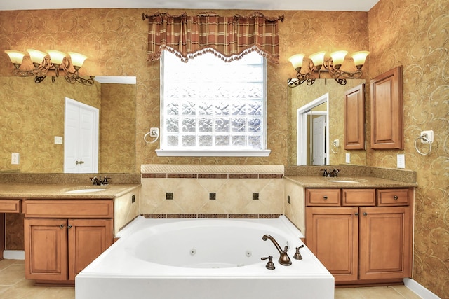 bathroom with tile patterned flooring, vanity, and a tub