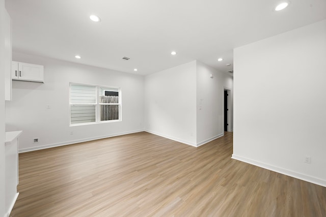 unfurnished living room with light hardwood / wood-style floors