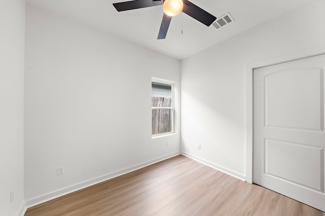 unfurnished room featuring ceiling fan and light hardwood / wood-style flooring