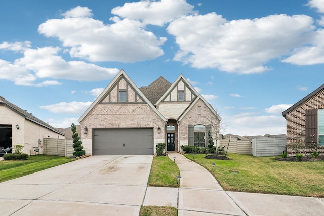 view of front of home with a front lawn and a garage