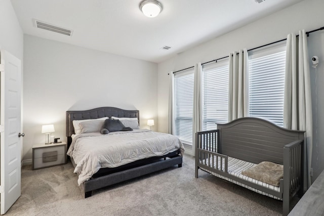 bedroom with light carpet