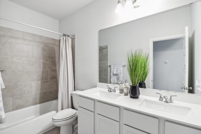 full bathroom featuring shower / bath combo, vanity, and toilet