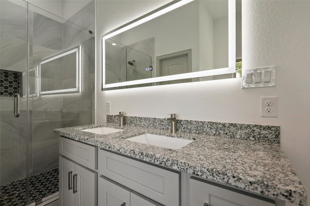 bathroom with vanity and walk in shower