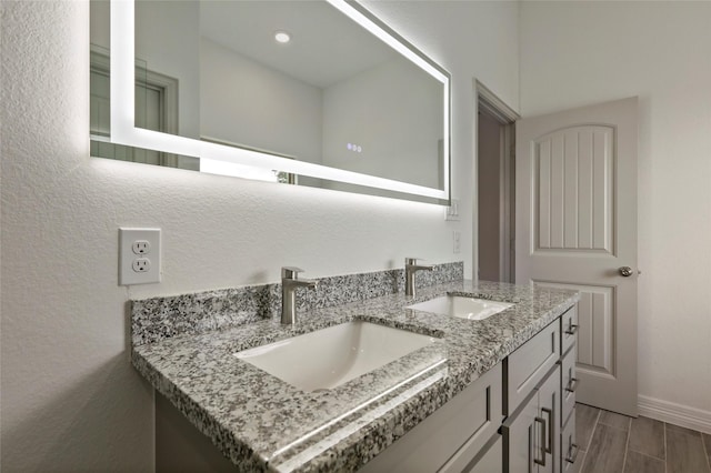 bathroom featuring hardwood / wood-style floors and vanity