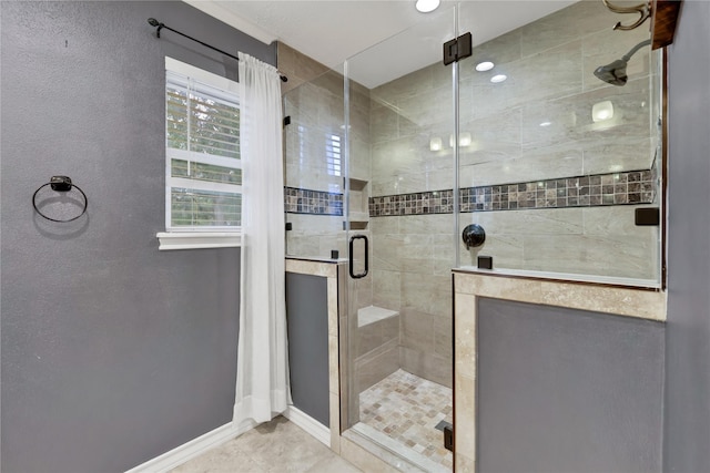 bathroom with tile patterned floors and a shower with shower door