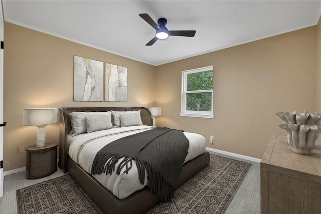 bedroom featuring carpet, ceiling fan, and ornamental molding